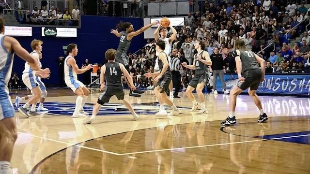 Ross Reeves sends up a pray to tie the game at the buzzer in DII men's basketball.