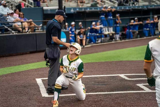 Saint Leo player crosses home plate in jubilation after advancing to the DII softball finals.